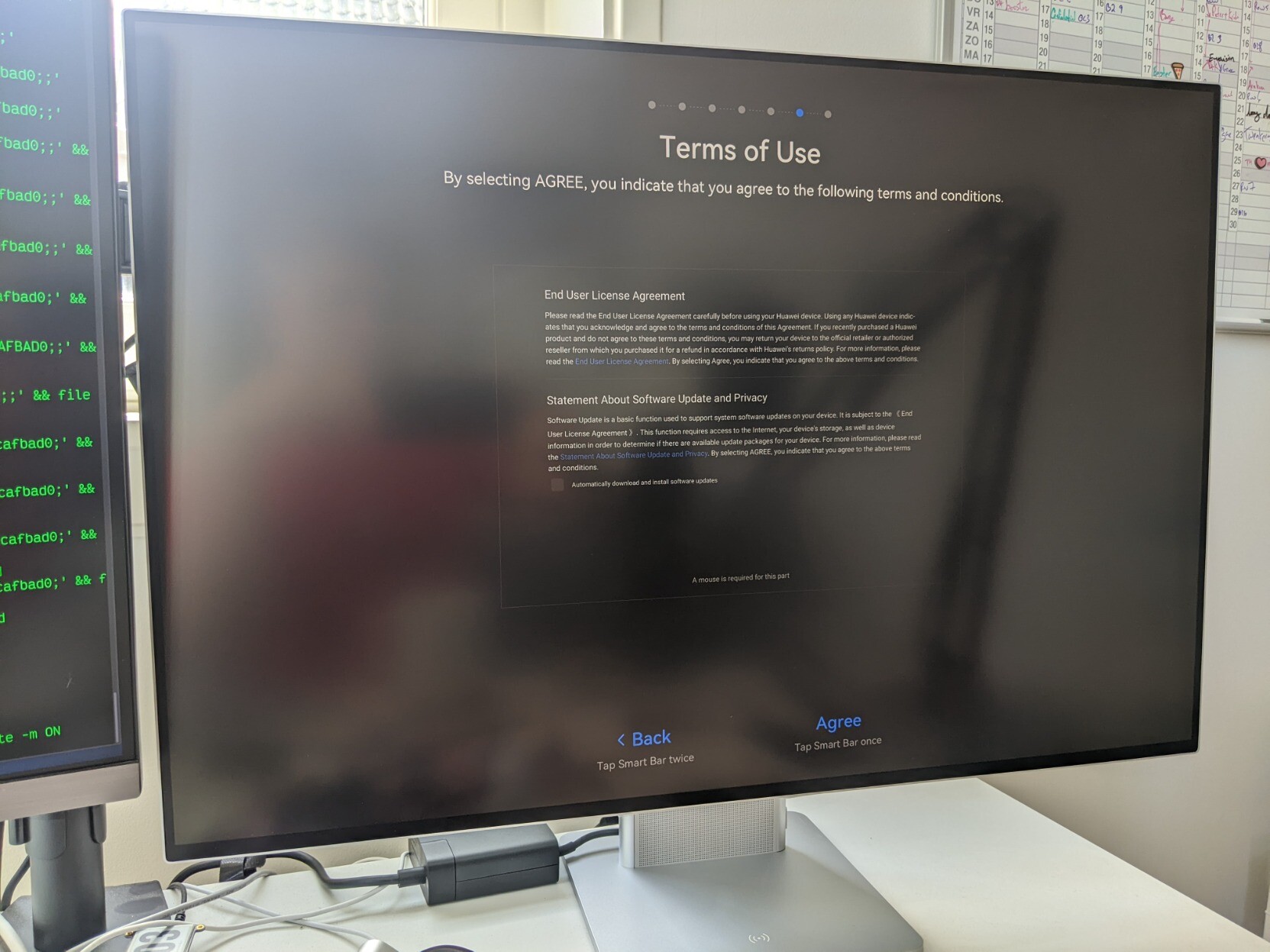monitor displaying "Terms of Use" as part of its first boot screen