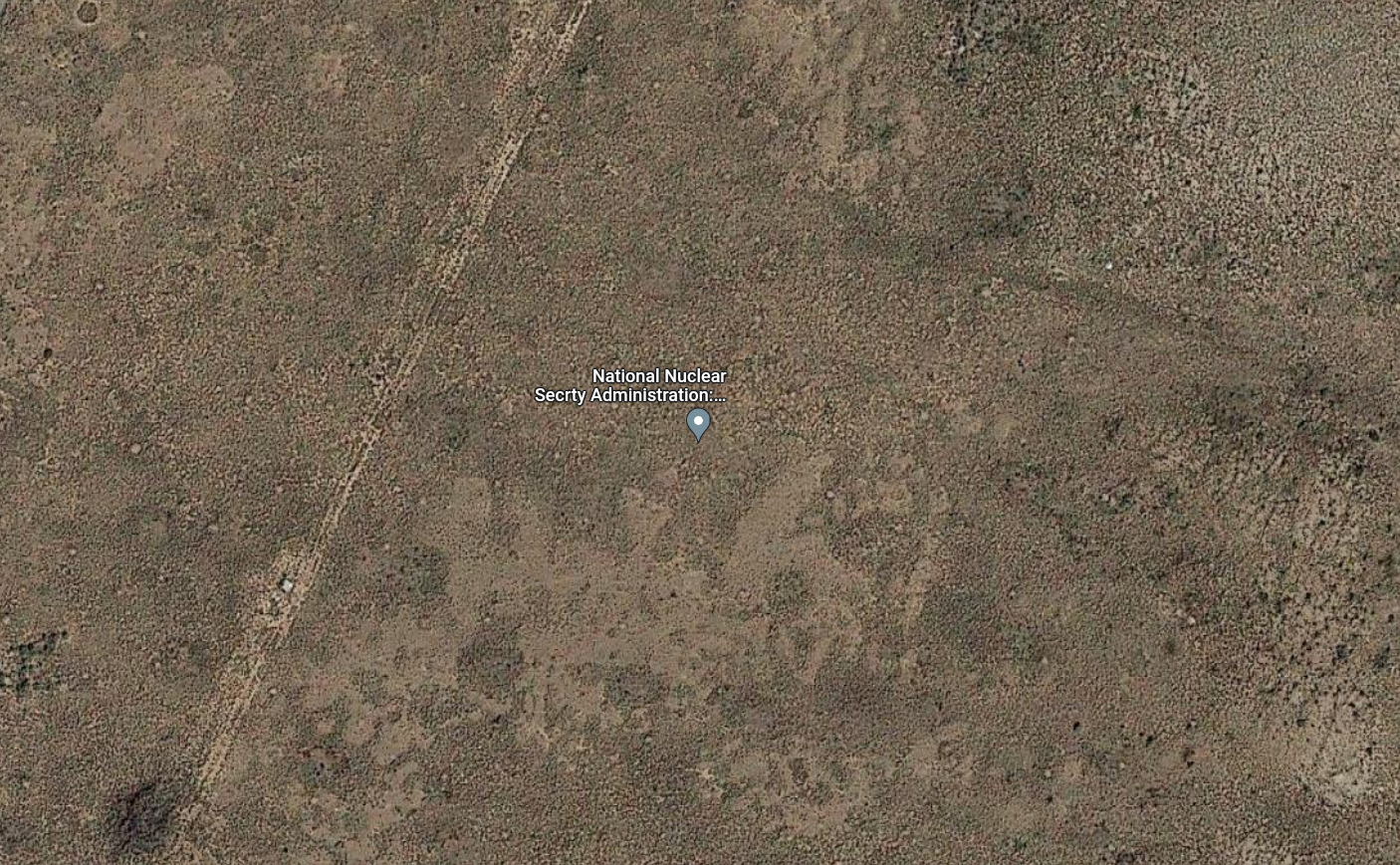 aerial satellite view of baren New Mexico landscape with a place marker for the National Nuclear Security Administration