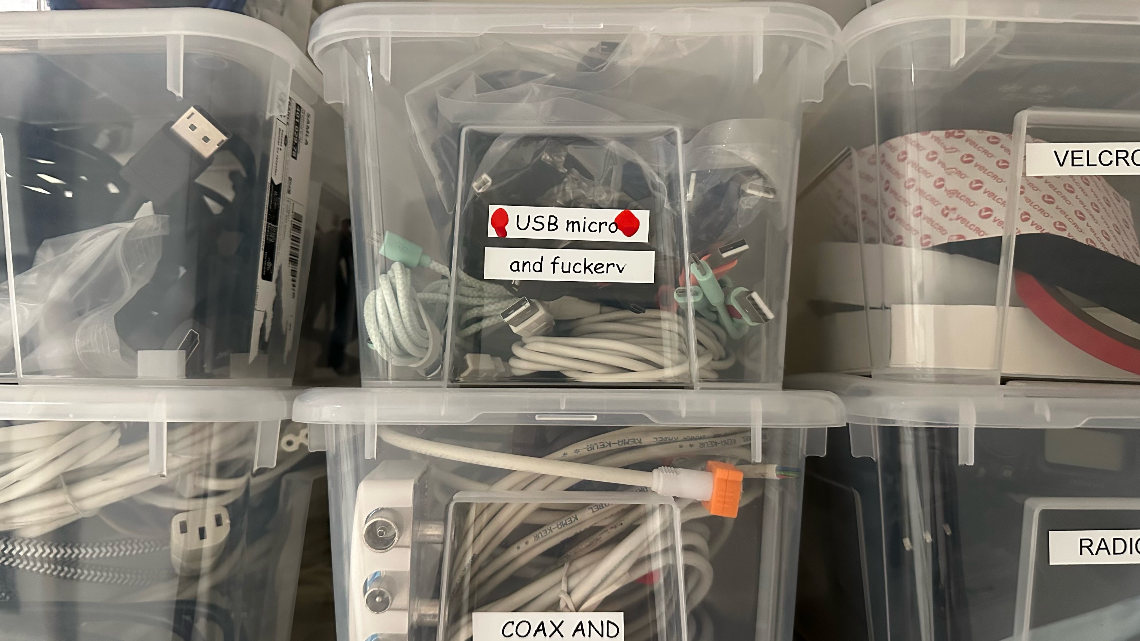 clear ikea box labeled "USB Micro (and fuckery)"