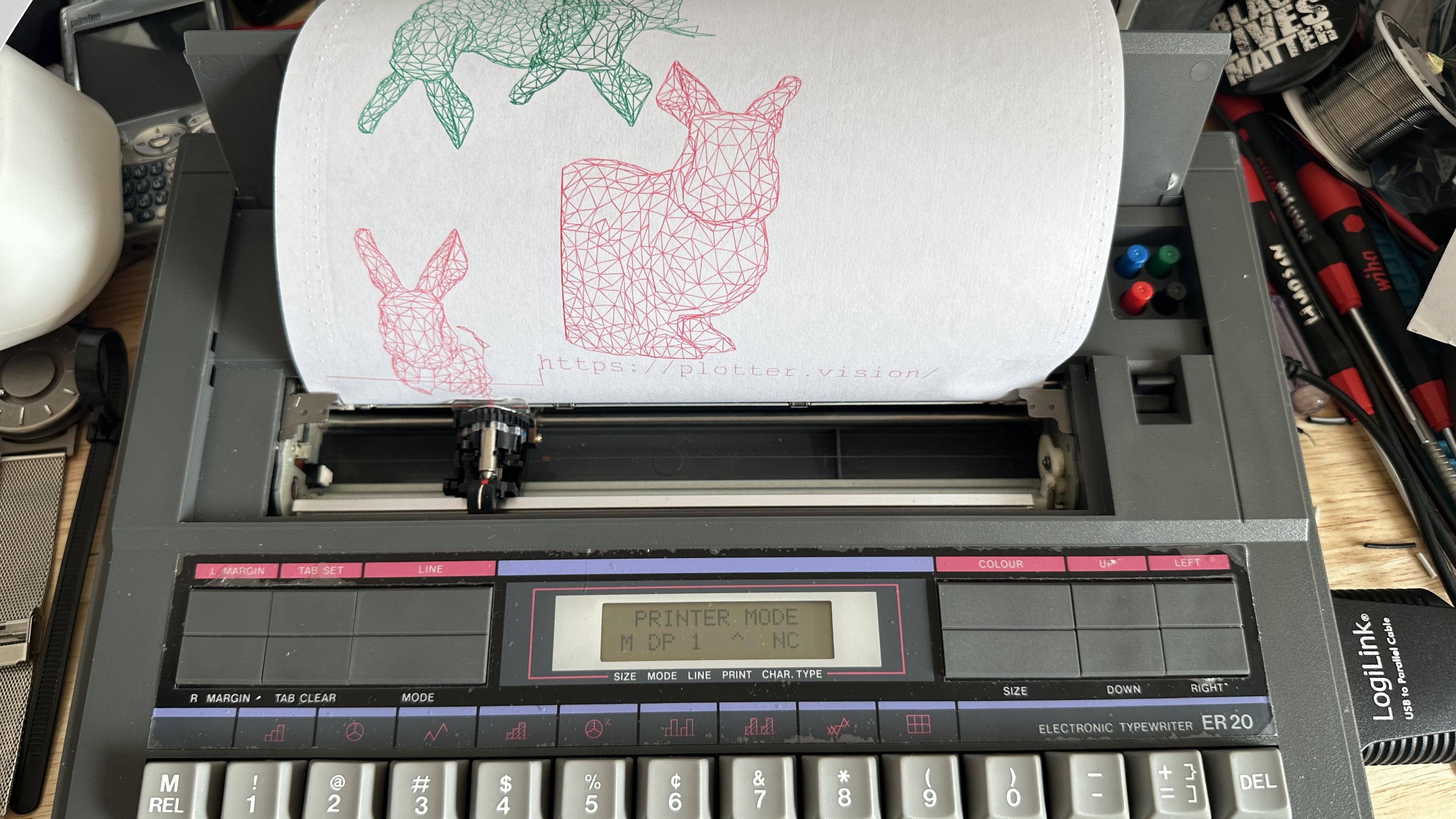 Typewriter with lots of wireframe bunnies in red and green. 