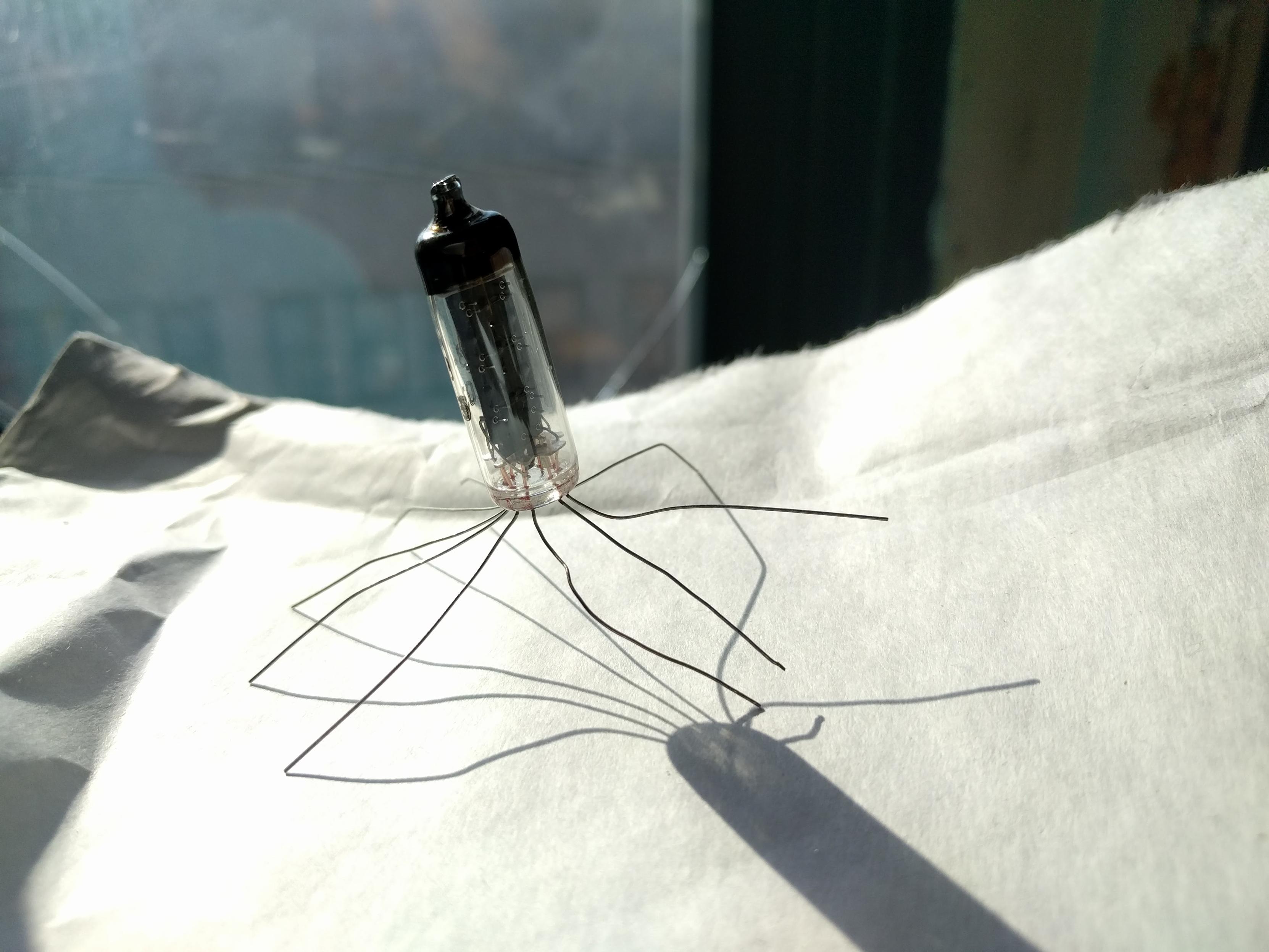 Numatron tube with the legs bent out like some sort of virus. 